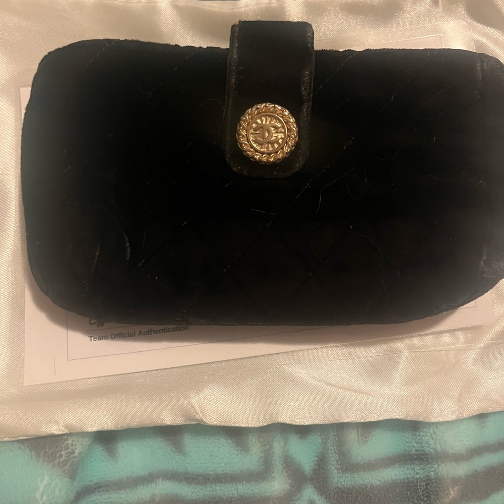 CHANEL Black Quilted Velvet Clutch Pouch with Gold Accent offers welcomed